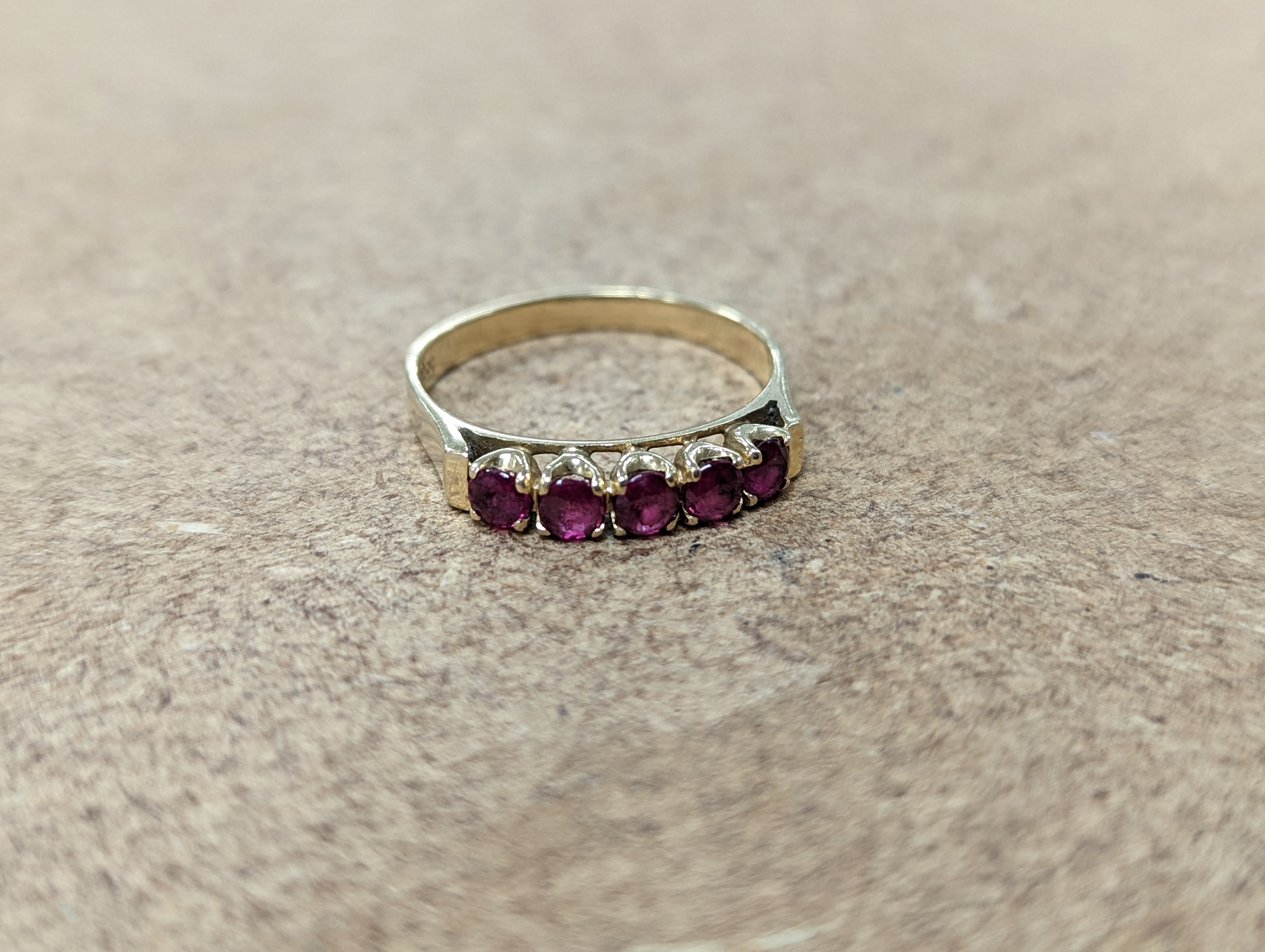 Two 18ct and diamond cluster rings, gross 5.3 grams, a 585 and diamond chip ring, gross 1.7 grams, a 9ct gold gem set ring and two 9ct pendants, gross 8.9 grams.